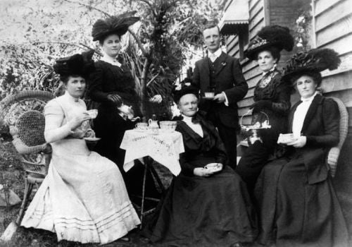 People drinking tea in garden historical black and white Queensland