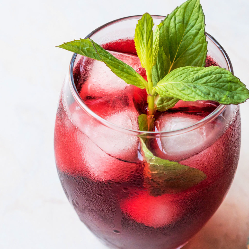 Hibiscus Iced Tea in glass with mint